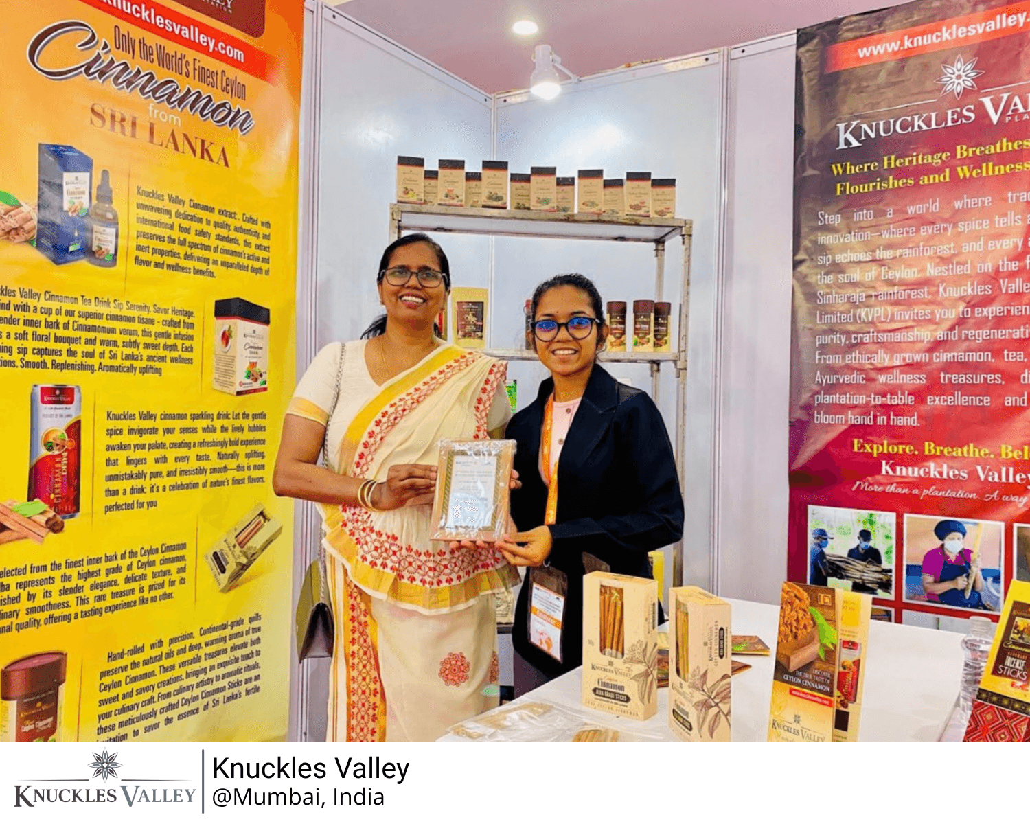 Two people at the Knuckles Valley exhibition stand in Mumbai