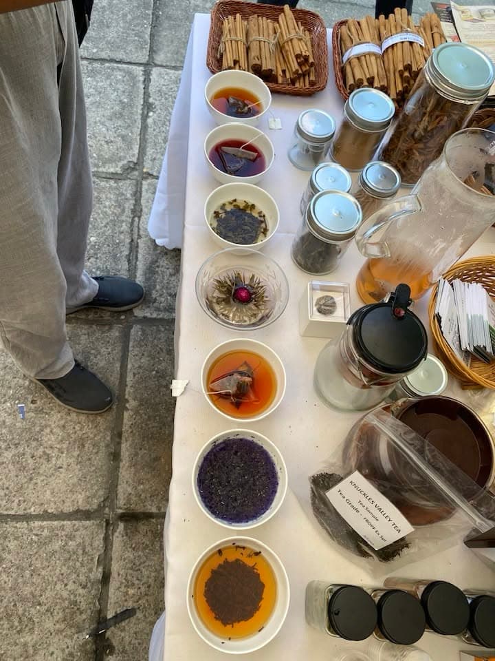 A tasting table in Beijing displays jars, sample bowls and cinnamon products.
