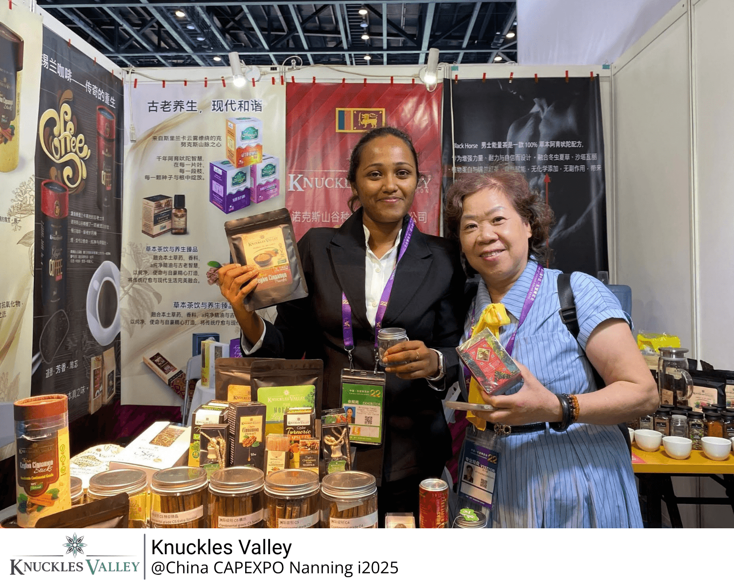 A Knuckles Valley representative and a visitor hold products at the exhibition stand in Nanning.