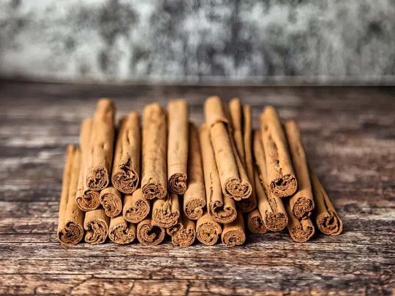 closeup-of-ceylon-cinnamon-sticks-on-wooden-table-2025-03-18-16-17-54-utc